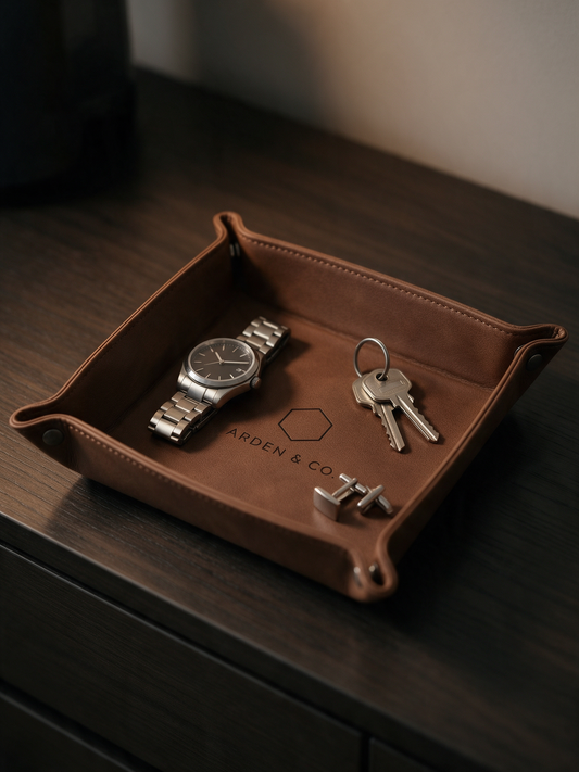 leatherette valet tray holding a watch and keys
