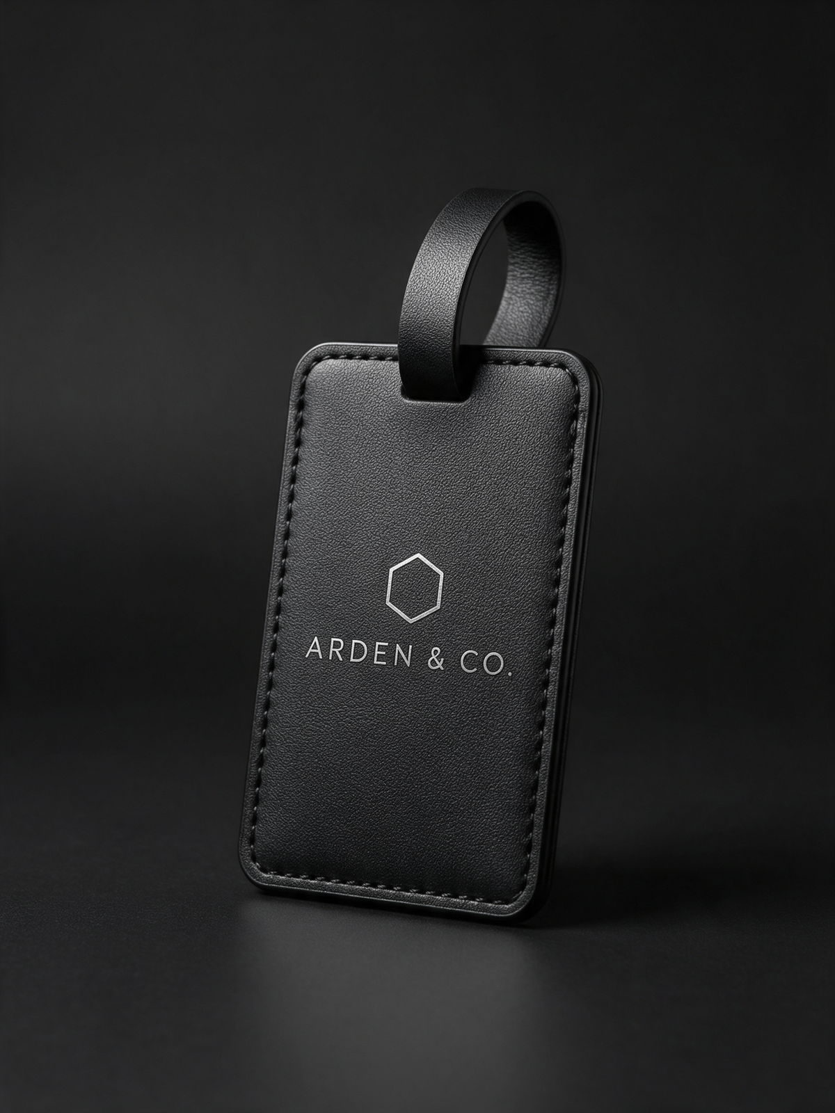black leatherette luggage tag laser engraved with a logo