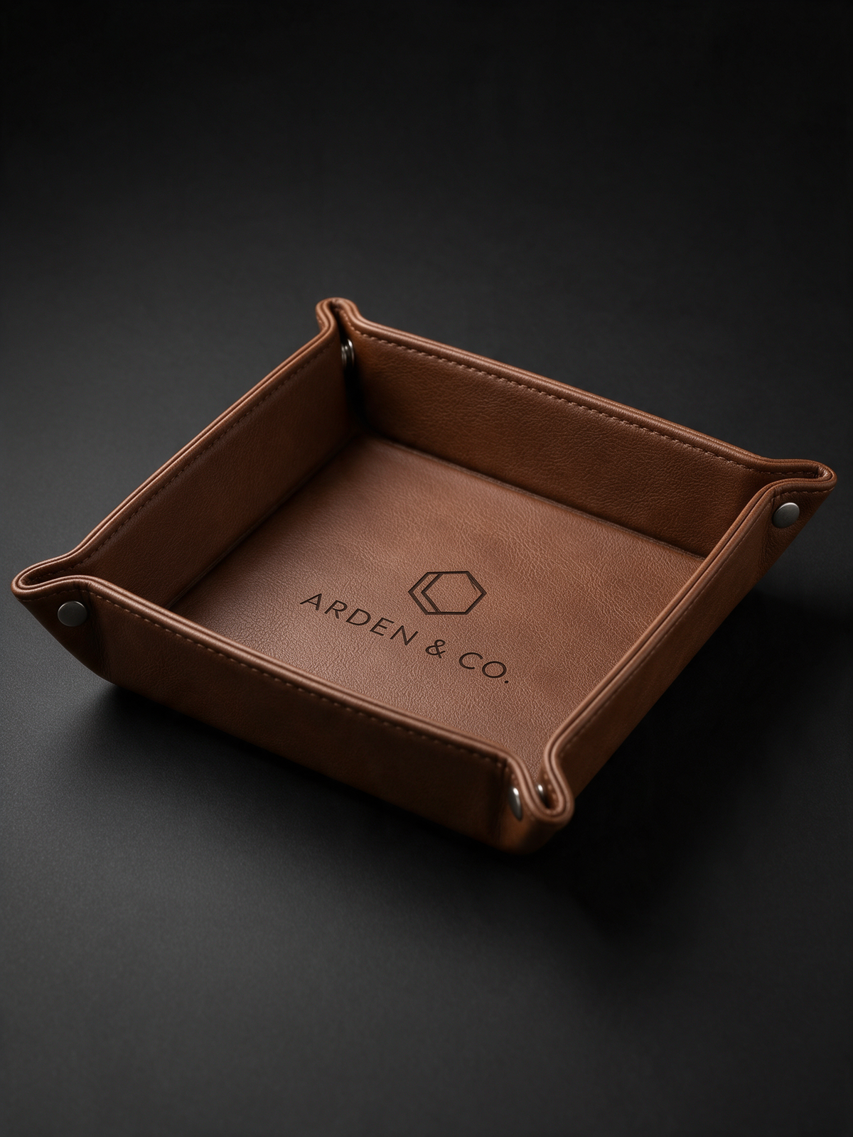 brown leatherette valet tray laser engraved with a logo