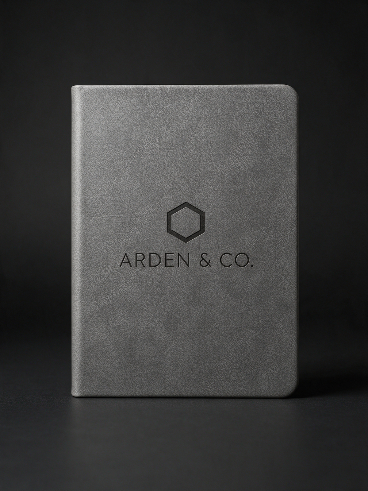 gray leatherette journal laser engraved with a logo