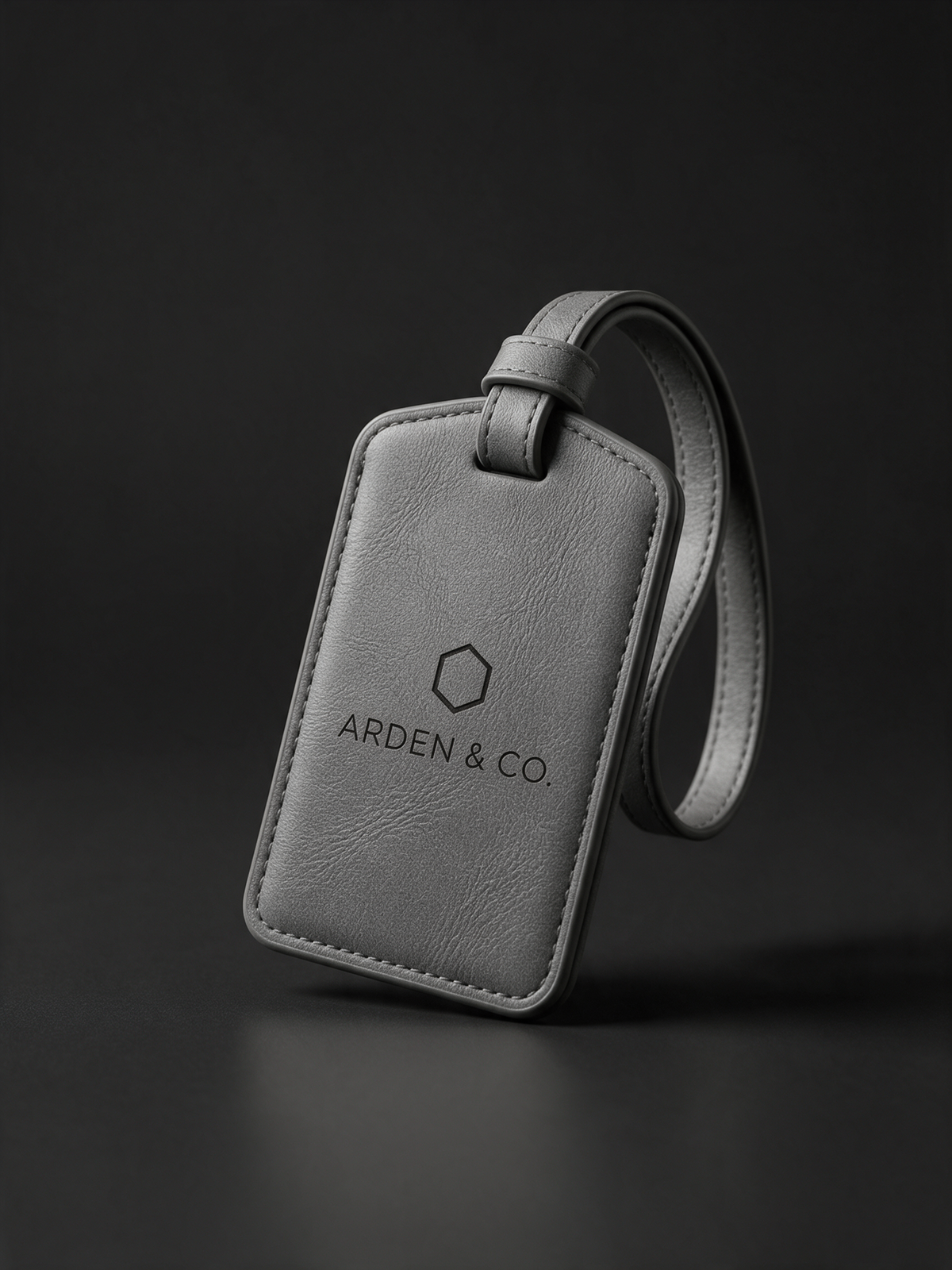 gray leatherette luggage tag laser engraved with a logo