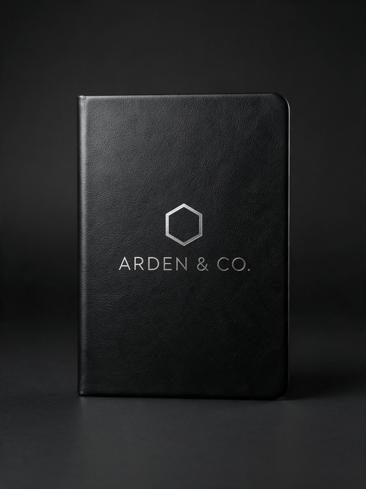 black leatherette journal laser engraved with a logo