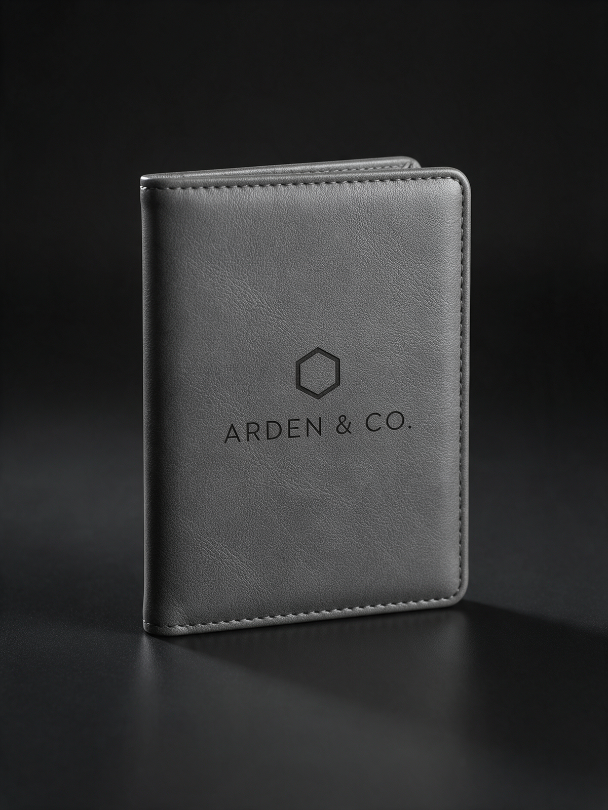 gray leatherette passport wallet laser engraved with a logo