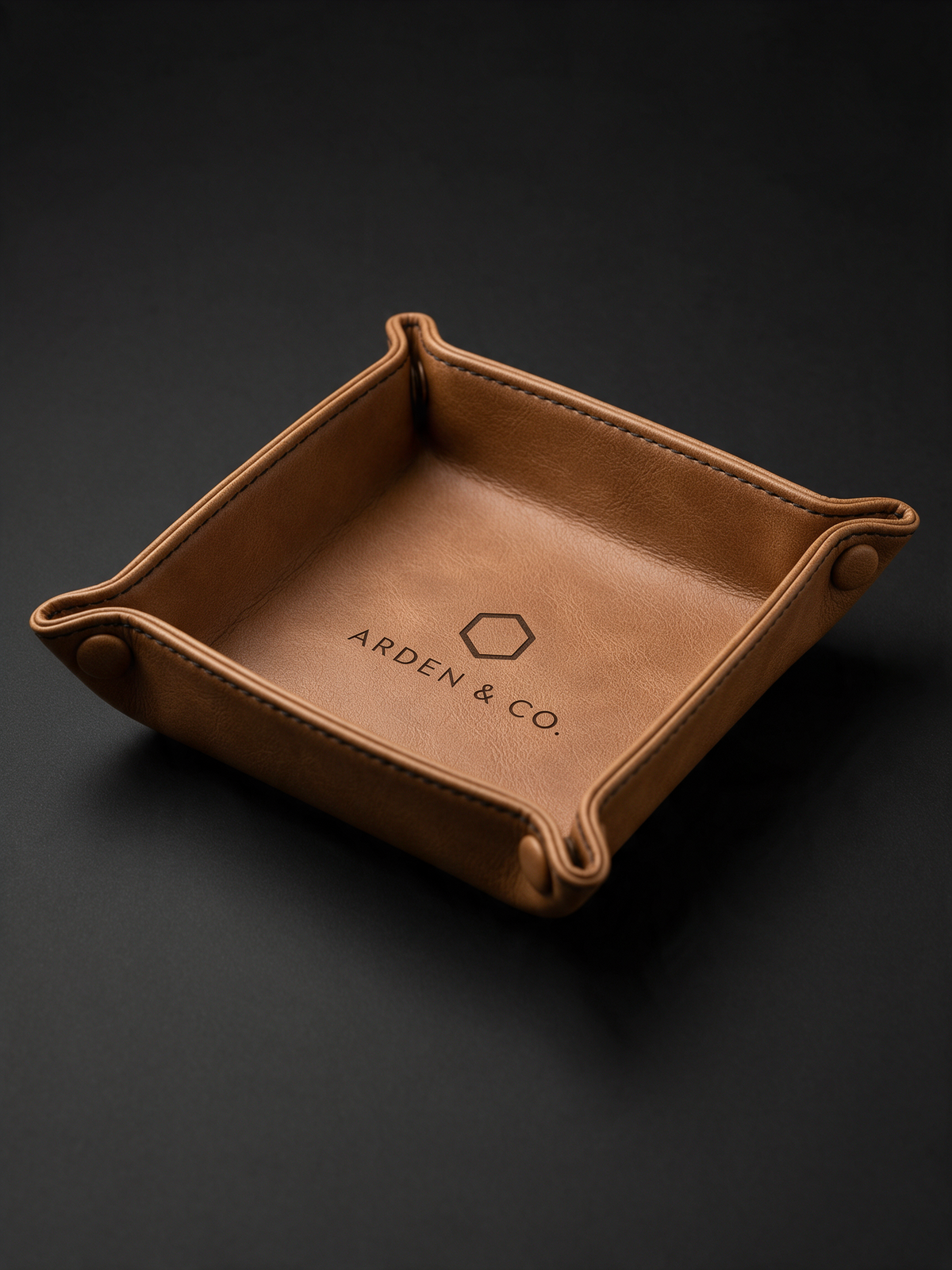 rawhide leatherette valet tray laser engraved with a logo