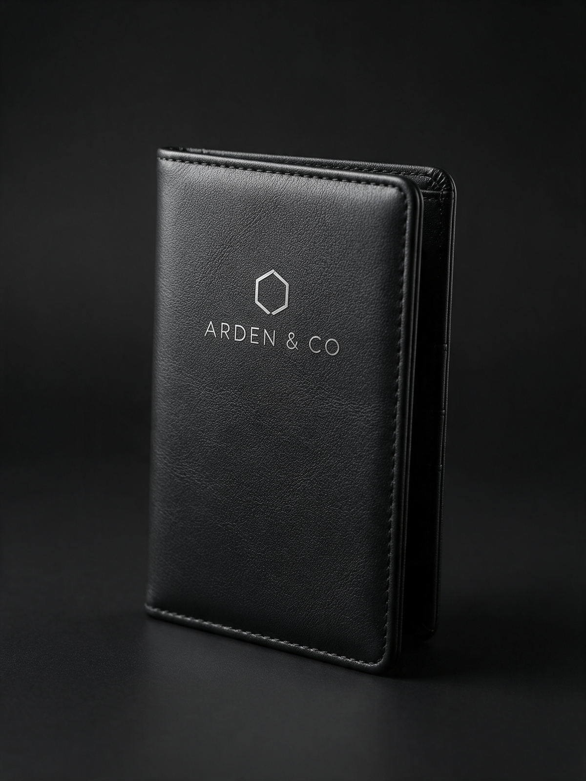 black leatherette passport wallet laser engraved with a logo
