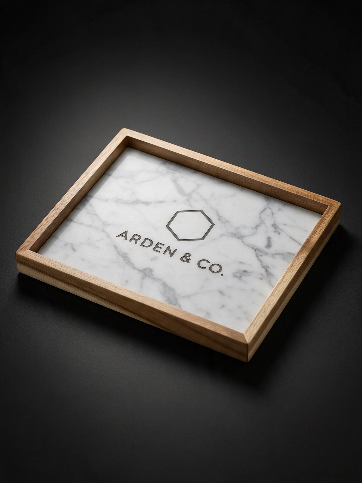 marble and wood valet tray laser engraved with a logo
