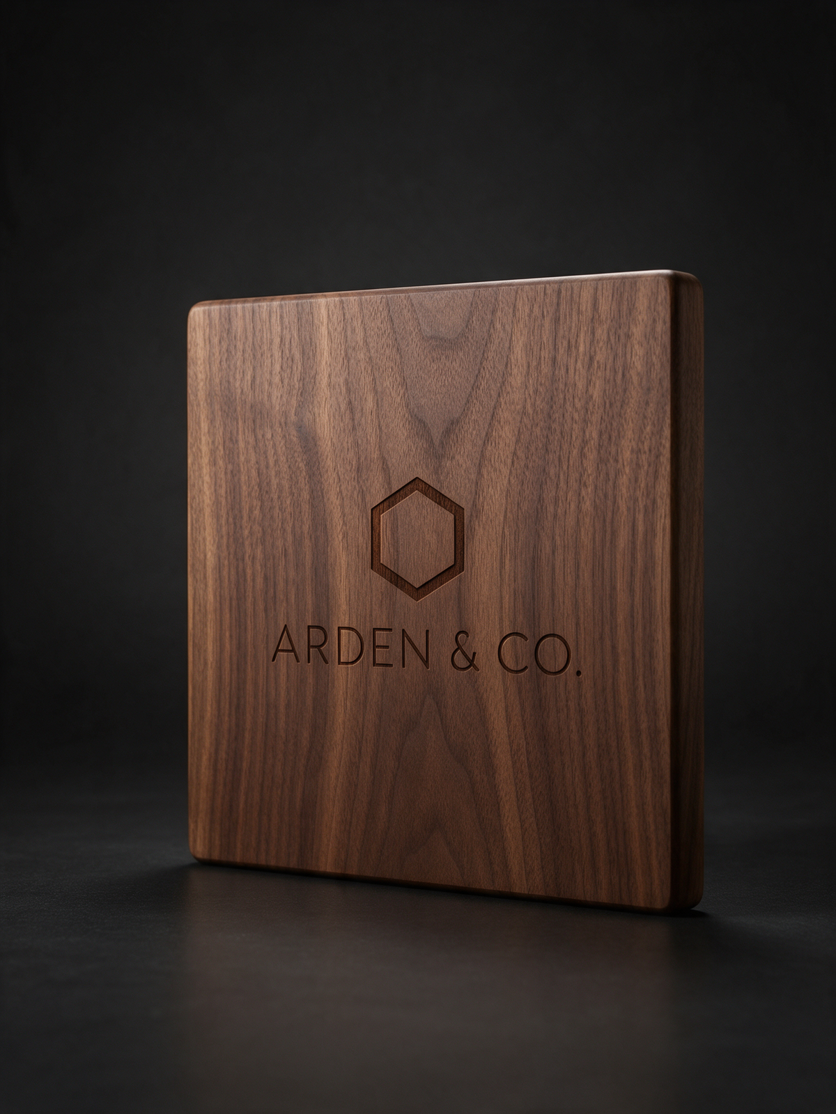 walnut wood cutting board laser engraved with a logo