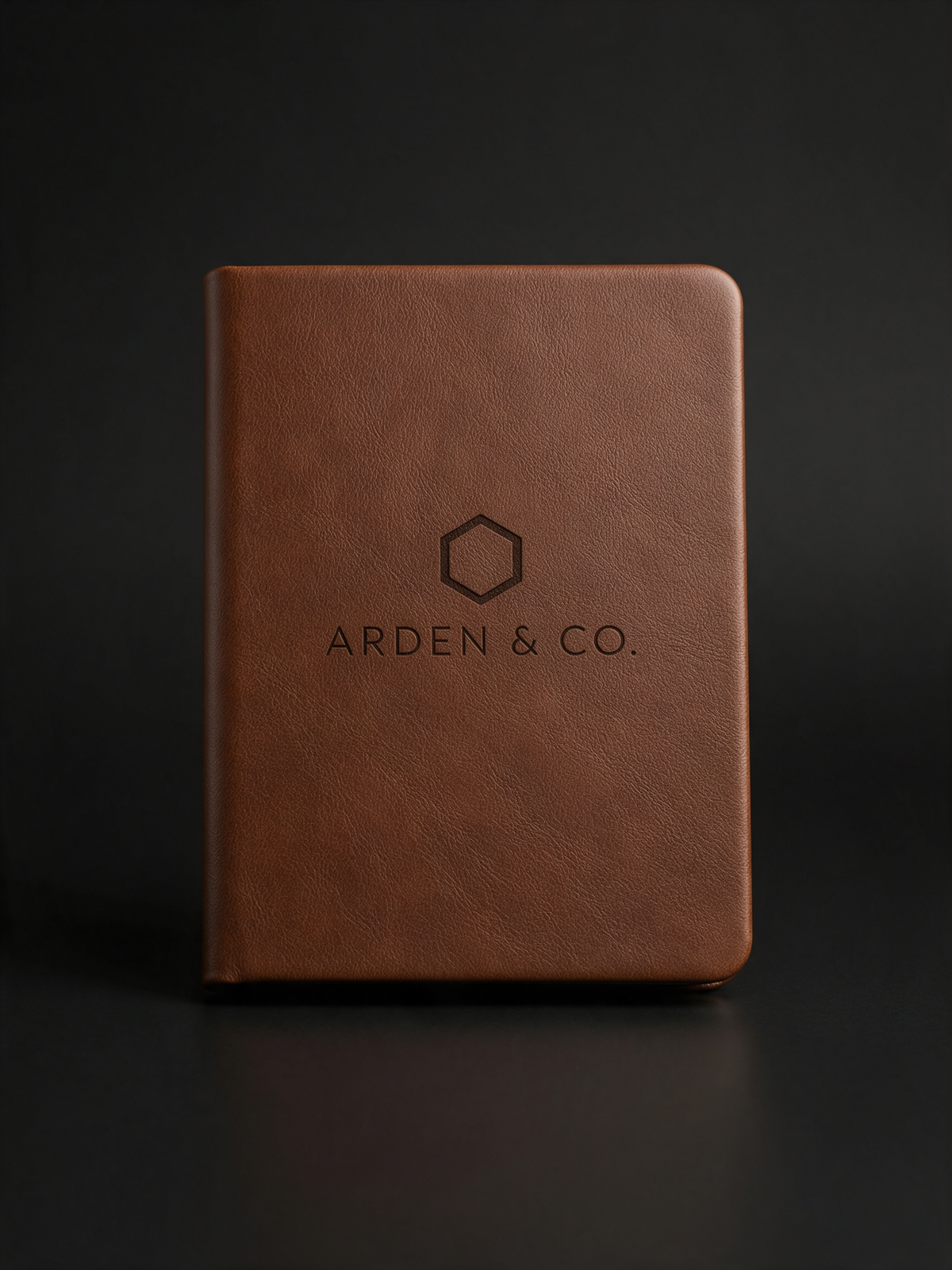 brown leatherette journal laser engraved with a logo